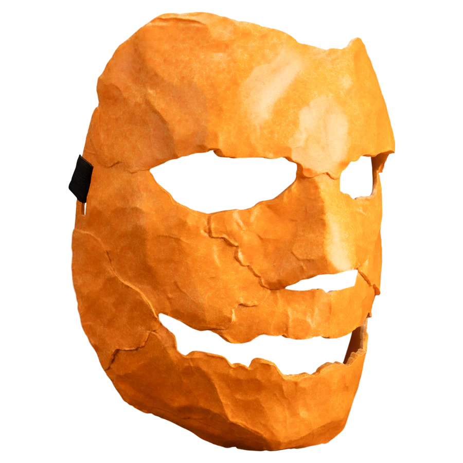 Orange mask with a carved face from Rob Zombie's Halloween