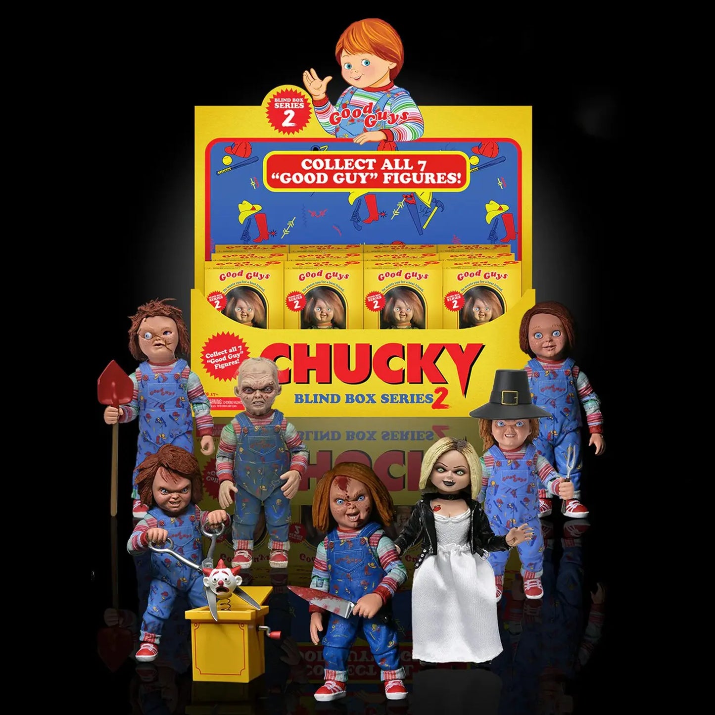Chucky action figures with a display box on a black background