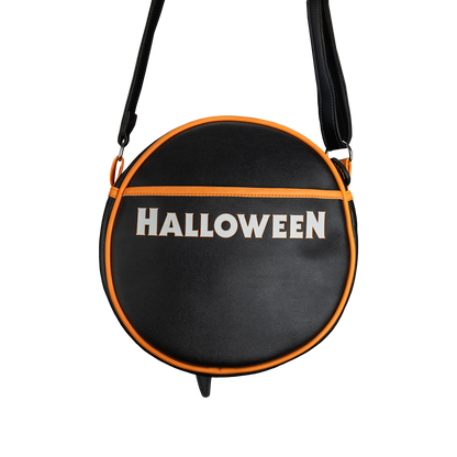 Back of the bag, black with Halloween written.