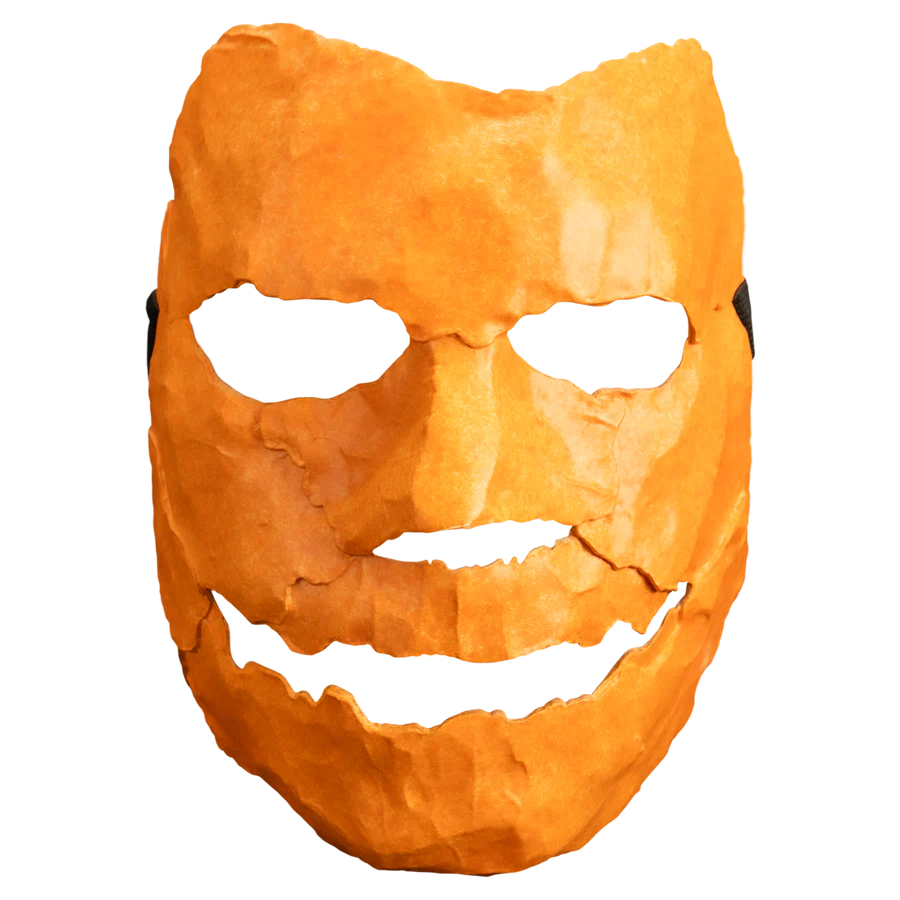 Orange mask with a carved face from Rob Zombie's Halloween