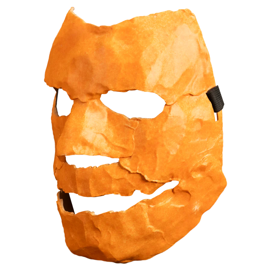 Orange mask with a carved face from Rob Zombie's Halloween